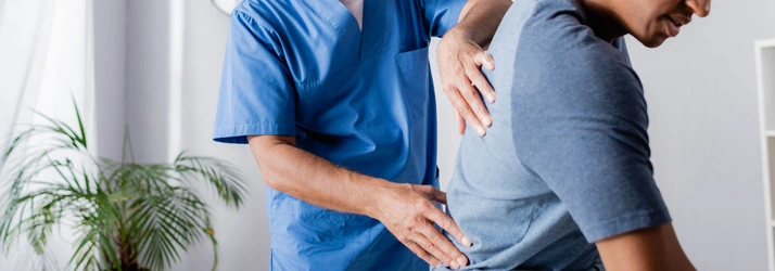 Chiropractic Saginaw MI Upper Back Exam A chiropractor performing a back exam.