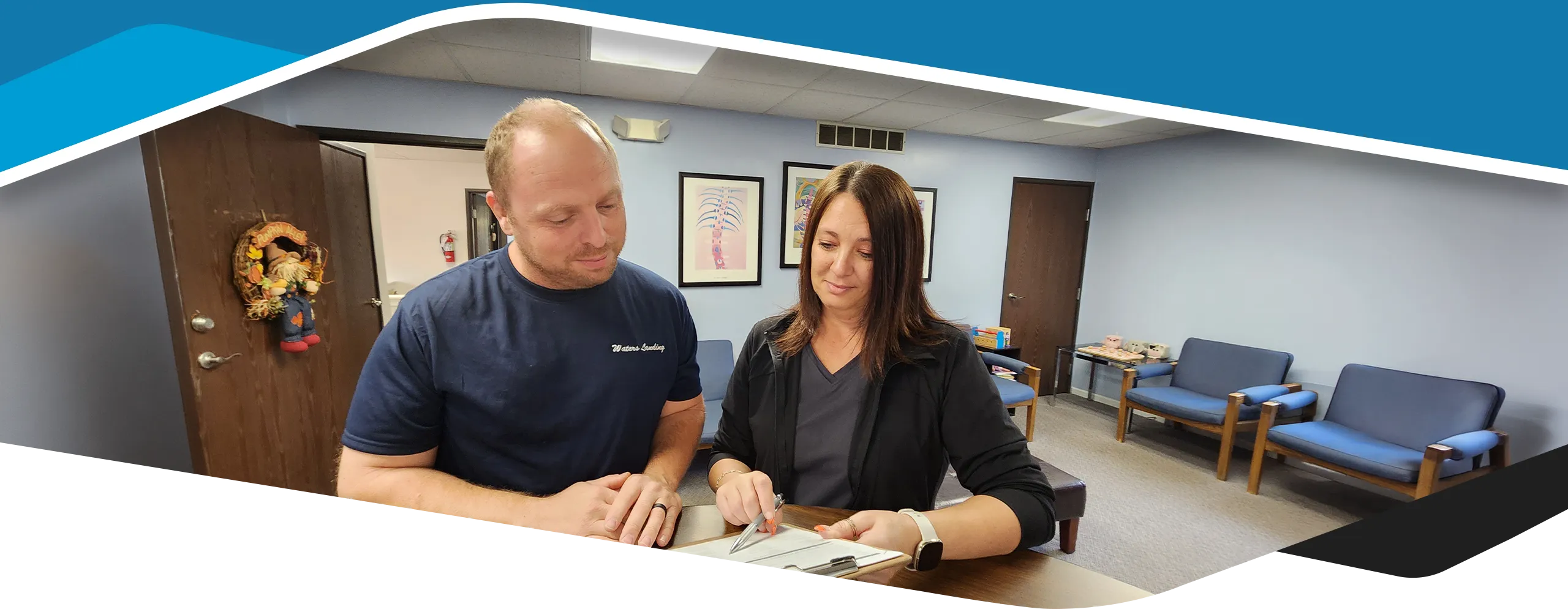 Staff Member Welcoming Patient To Office